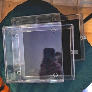 2 clear stacked jewelry showcases
